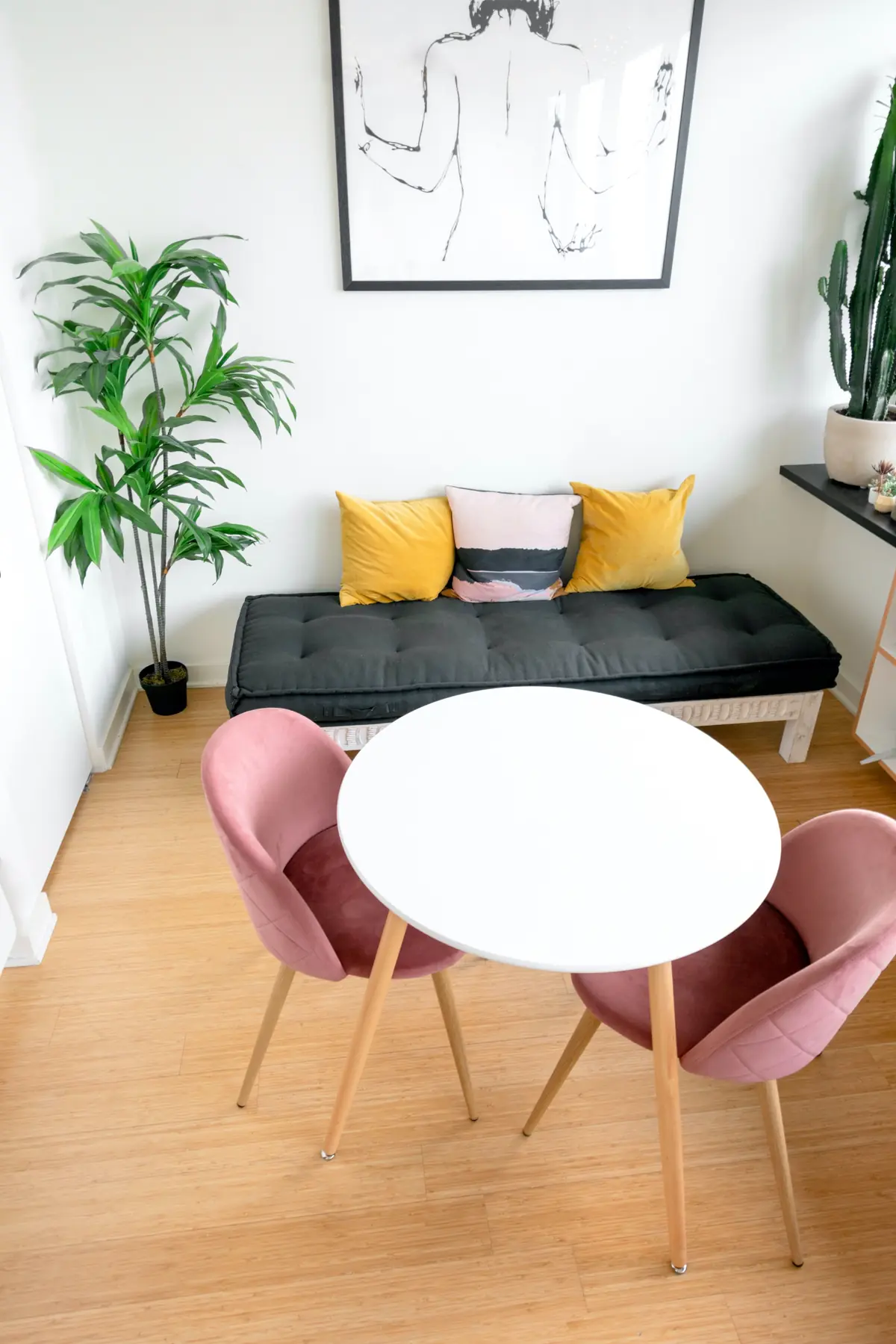 Dining corner of a small Dallas apartment with bench seating